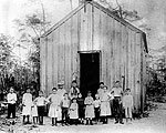 Portrait of First Class in Front of First Schoolhouse, 1889