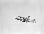 View of the Space Shuttle Discovery Being Flown Over the Capital City, Tallahassee, 1992